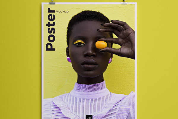 Vertical Poster Hanged Over a Wall by Two Clips Mockup FREE PSD