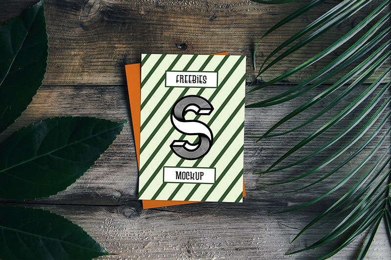Card Mockup with Plant and Wooden Background FREE PSD