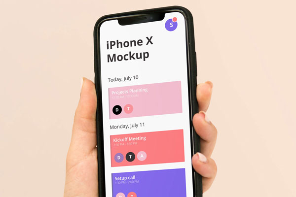 iPhone X in a Woman's Hand Mockup FREE PSD