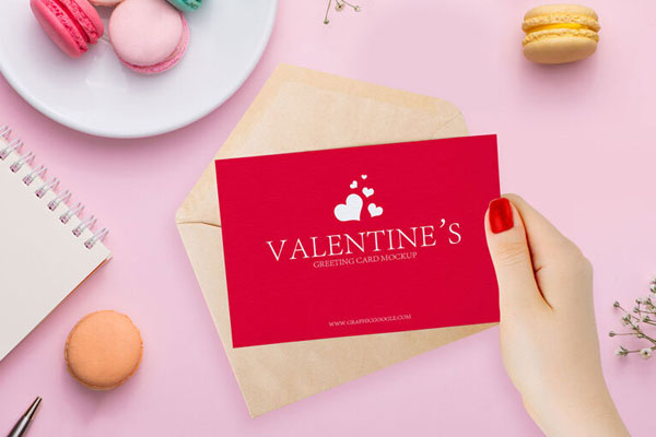 Lovely Valentines Greeting Card in a Girl Hand Mockup FREE PSD