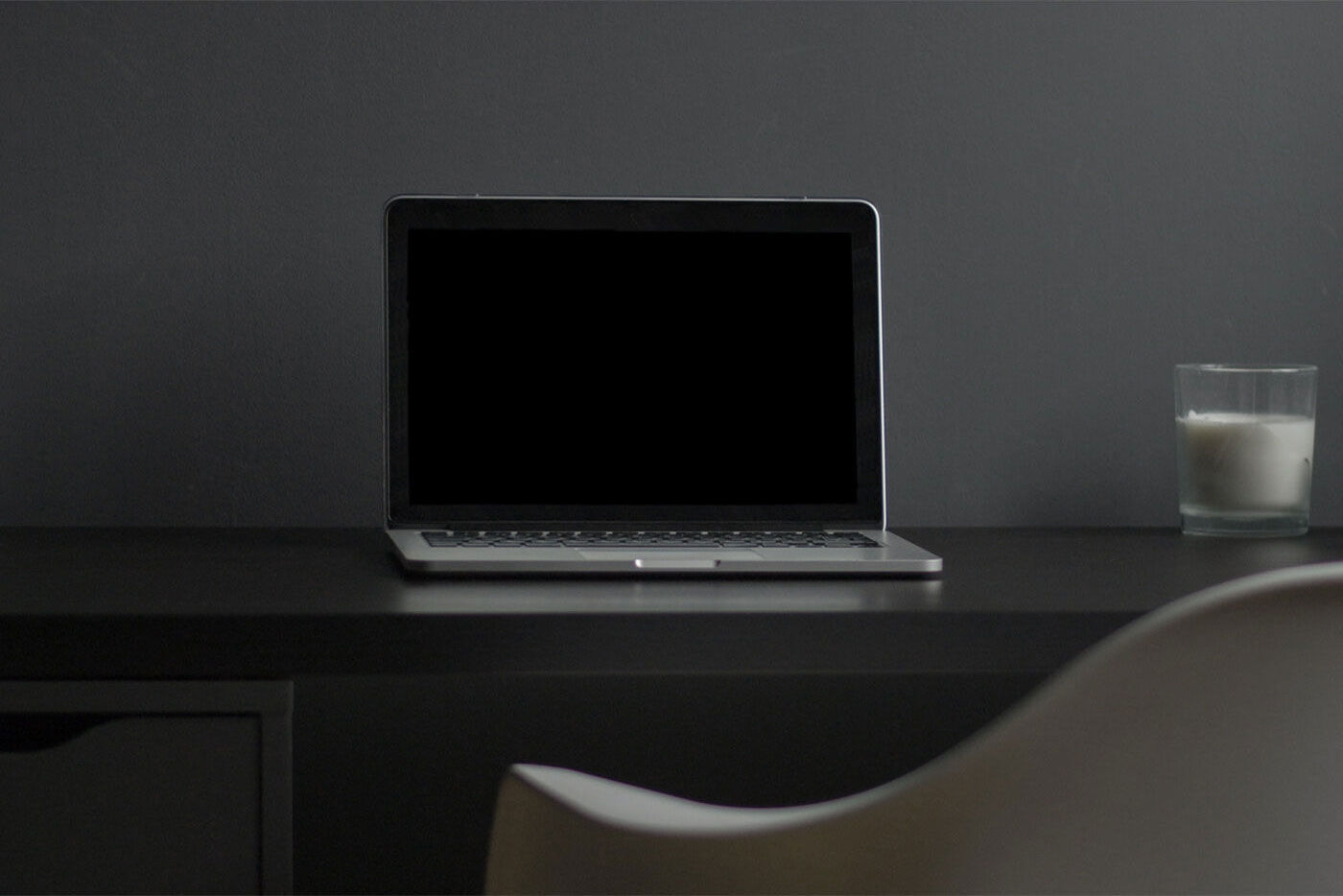 MacBook Screen Mockup on Desk with a Candle on the Right Side FREE PSD