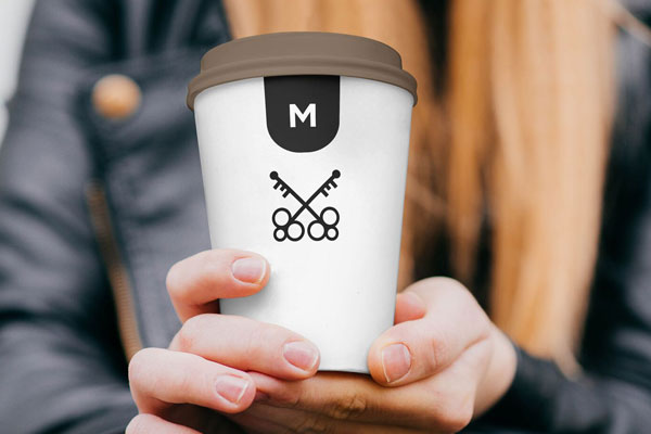 Mockup Displaying Smiling Girl Holding a Coffee Cup FREE PSD