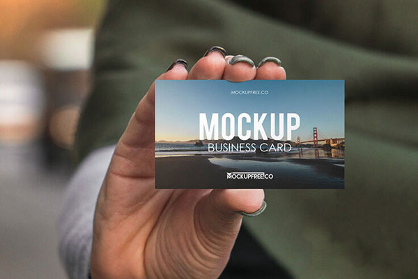Mockup Featuring a Hand Holding Business Card FREE PSD
