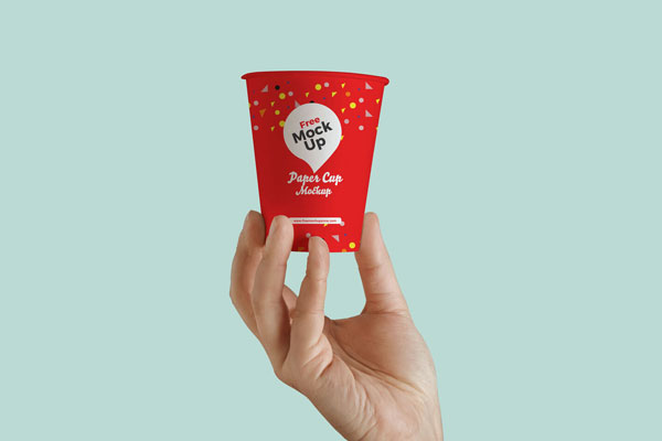 Mockup Featuring a Paper Cup Held by Hand in a Front View FREE PSD