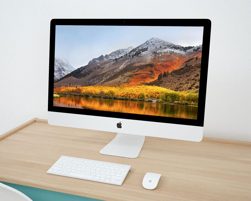 Mockup Featuring iMac on Wooden Desk in Perspective FREE PSD