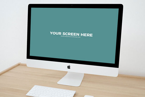 Mockup Featuring iMac on Wooden Desk in Perspective FREE PSD