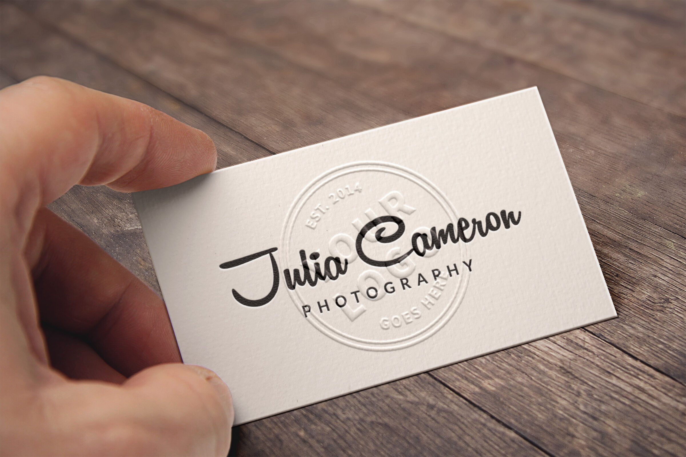 Mockup of a Hand Holding an Embossed Business Card FREE PSD