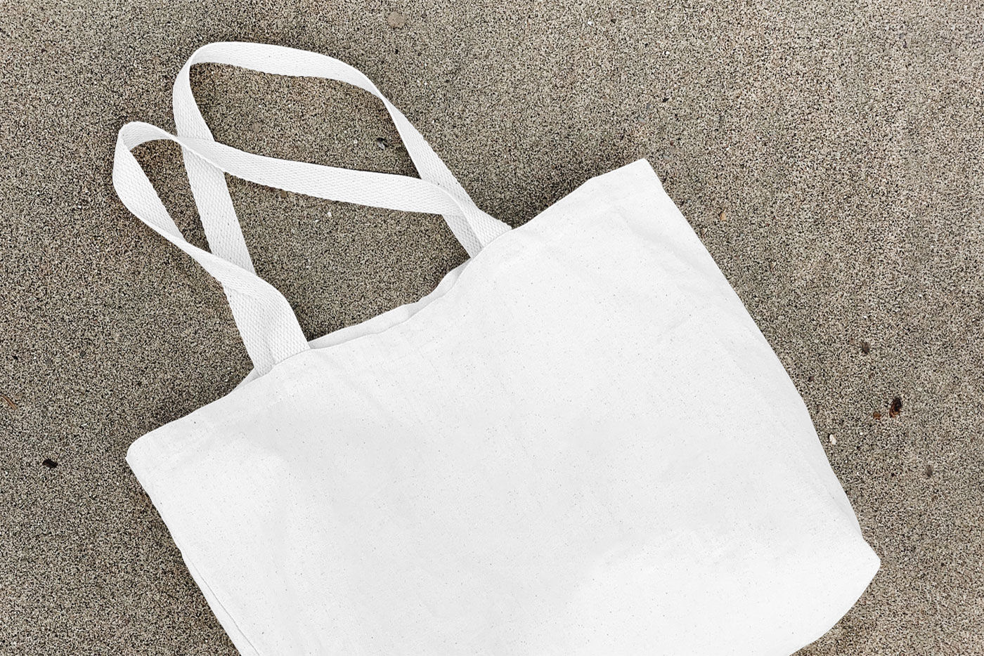 Mockup of a Lying Cotton Canvas Bag FREE PSD