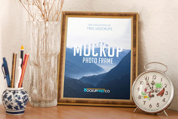Mockup of a Photo Frame Decorated with a Clock and Vases FREE PSD