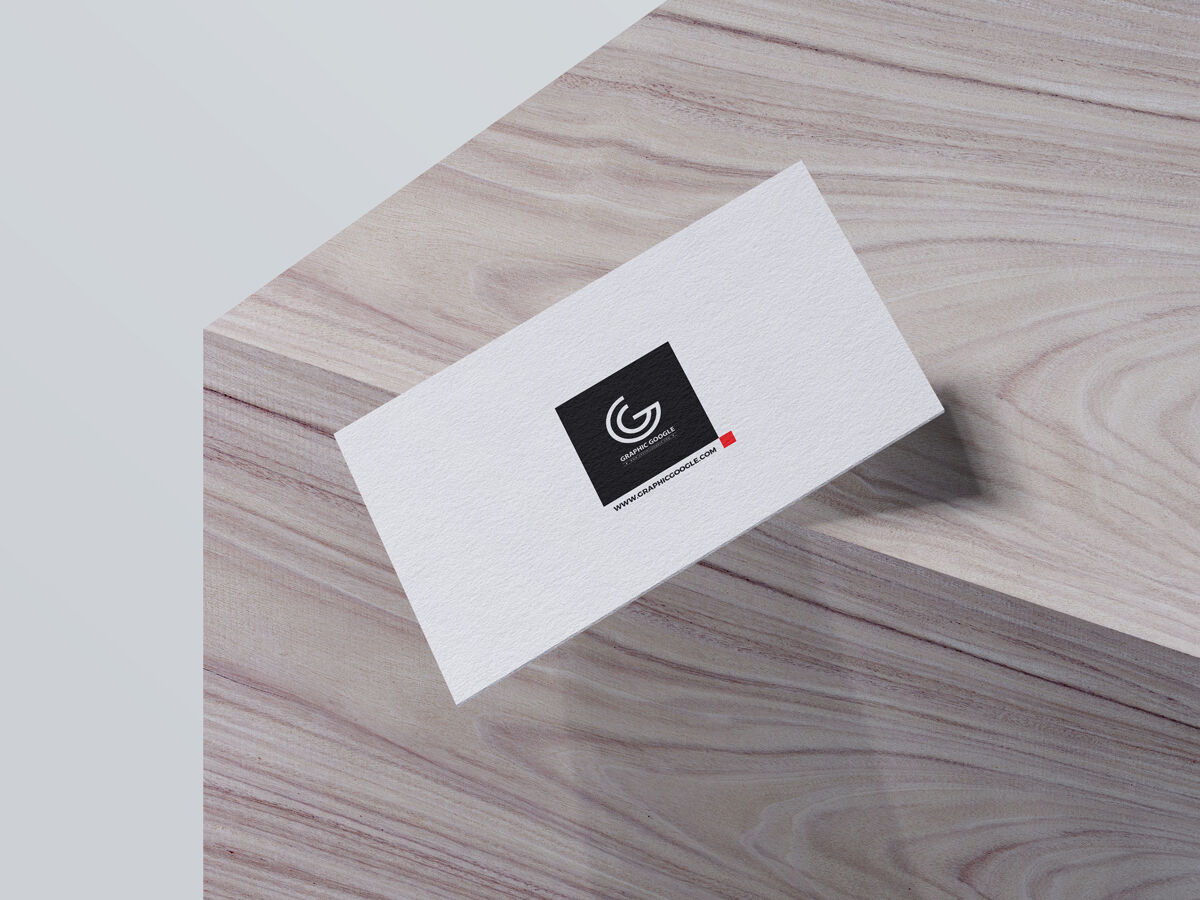 Mockup of Business Card Falling off a Wooden Box in Perspective FREE PSD