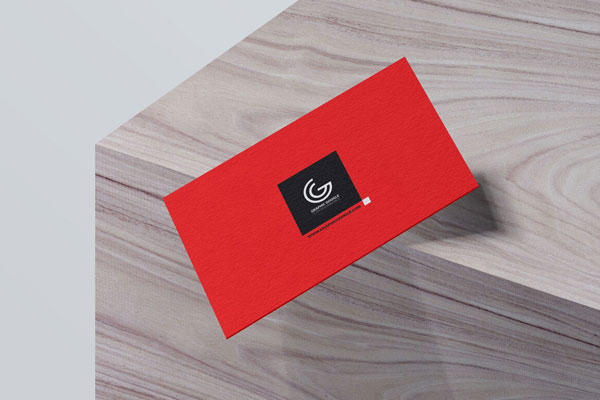 Mockup of Business Card Falling off a Wooden Box in Perspective FREE PSD