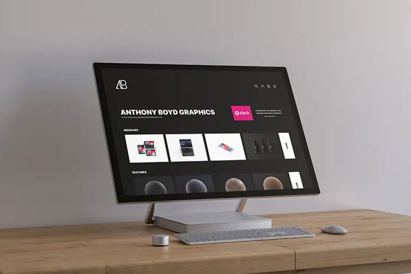 Mockup Showcasing Surface Studio on a Wooden Table FREE PSD