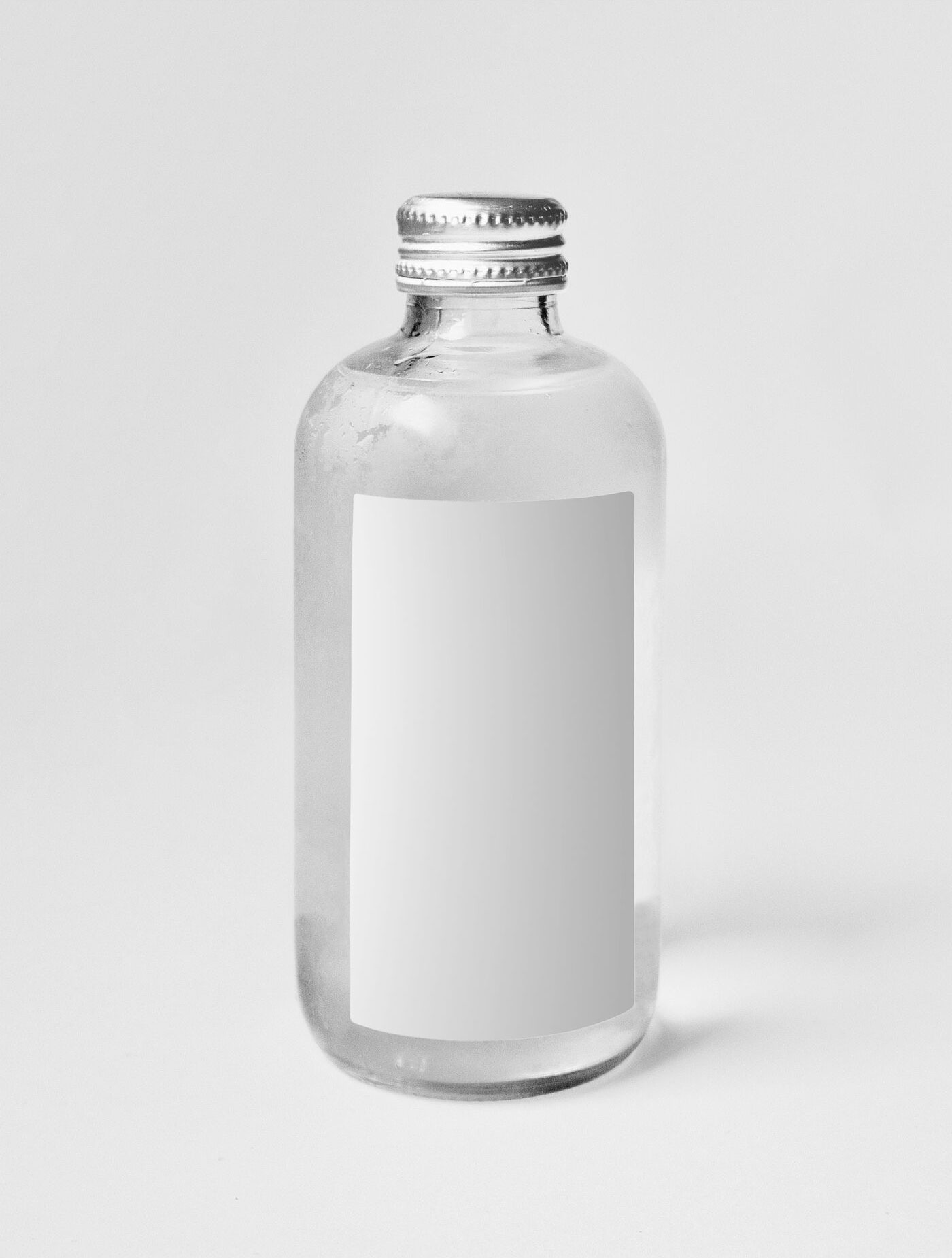 Mockup Showing a Minimal Mini Glass Bottle FREE PSD