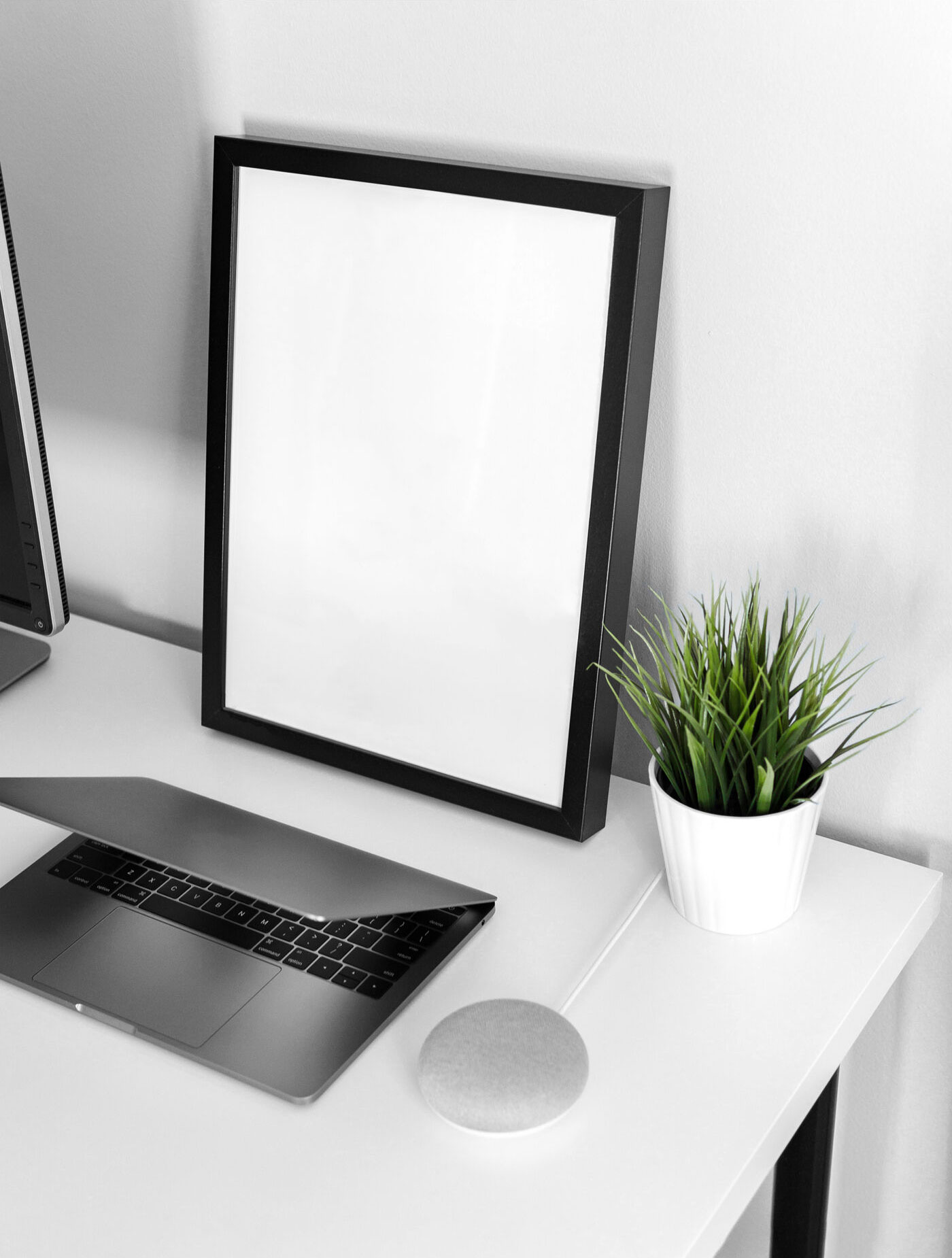 Mockup Showing Frame Poster on a Table with Laptop and Vase FREE PSD