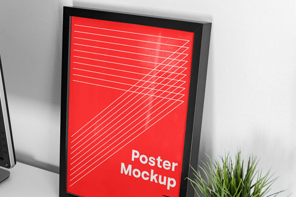 Mockup Showing Frame Poster on a Table with Laptop and Vase FREE PSD