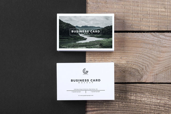 Modern Business Card Mockup Laying on a Wooden Texture Surface FREE PSD