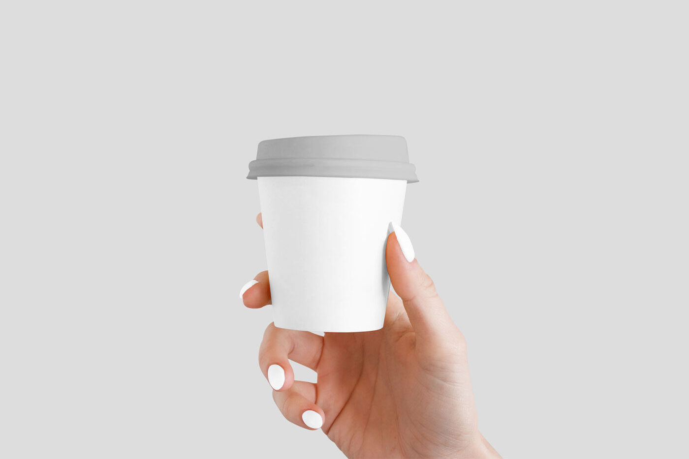 Mokcup Including a Handing Holding up a Small Coffee Cup FREE PSD