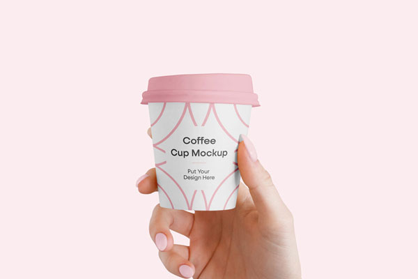 Mokcup Including a Handing Holding up a Small Coffee Cup FREE PSD