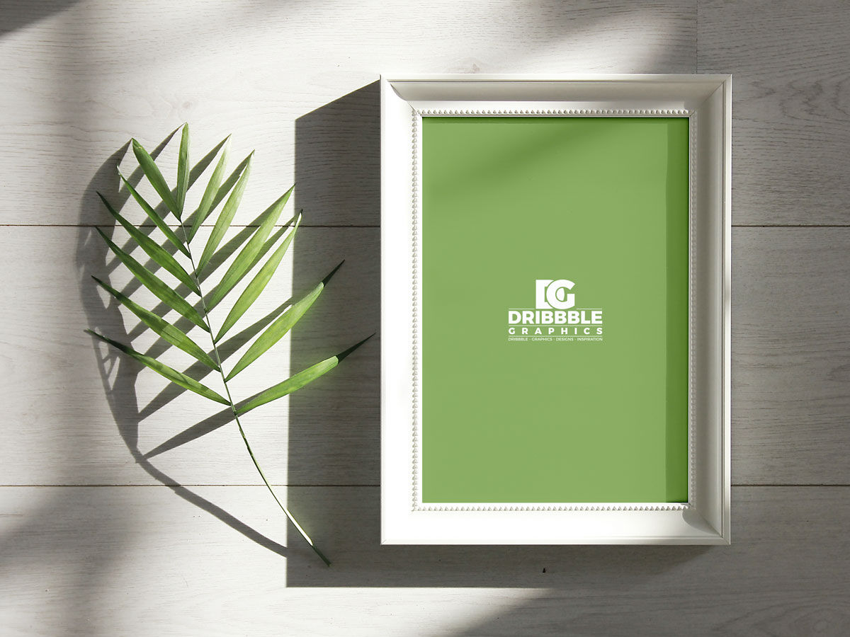 Overhead View of Photo Frame Next to a Branch Mockup FREE PSD
