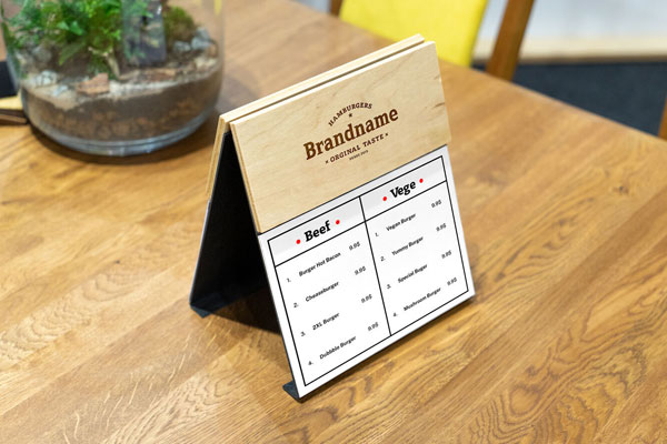 Perspective View of a Wooden Menu Mockup on Table FREE PSD