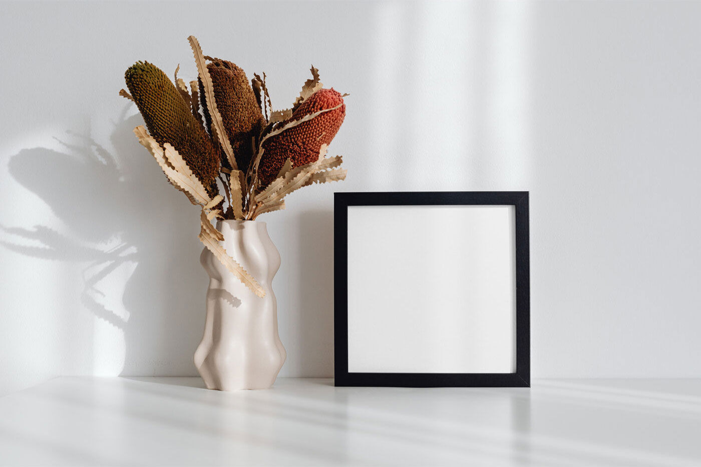 Picture Frame Mockup With Flower On Desk FREE PSD
