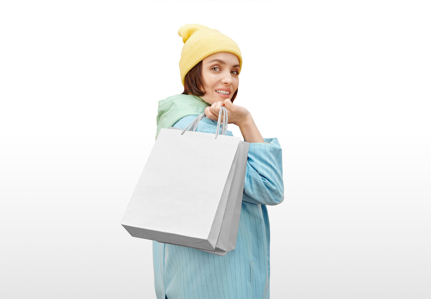 Shopping Bag Mockup Featuring a Woman Looking over Shoulder FREE PSD