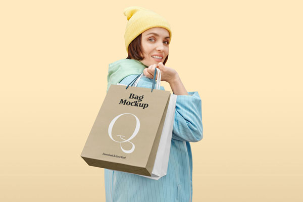 Shopping Bag Mockup Featuring a Woman Looking over Shoulder FREE PSD