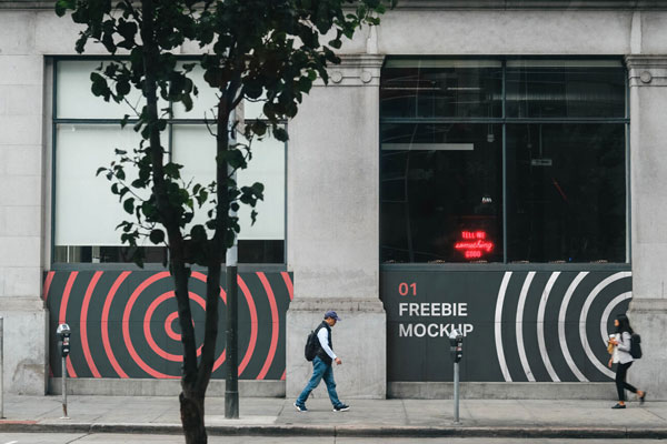 Storefront Wall Mockup Featuring Pedestrian and Trees FREE PSD