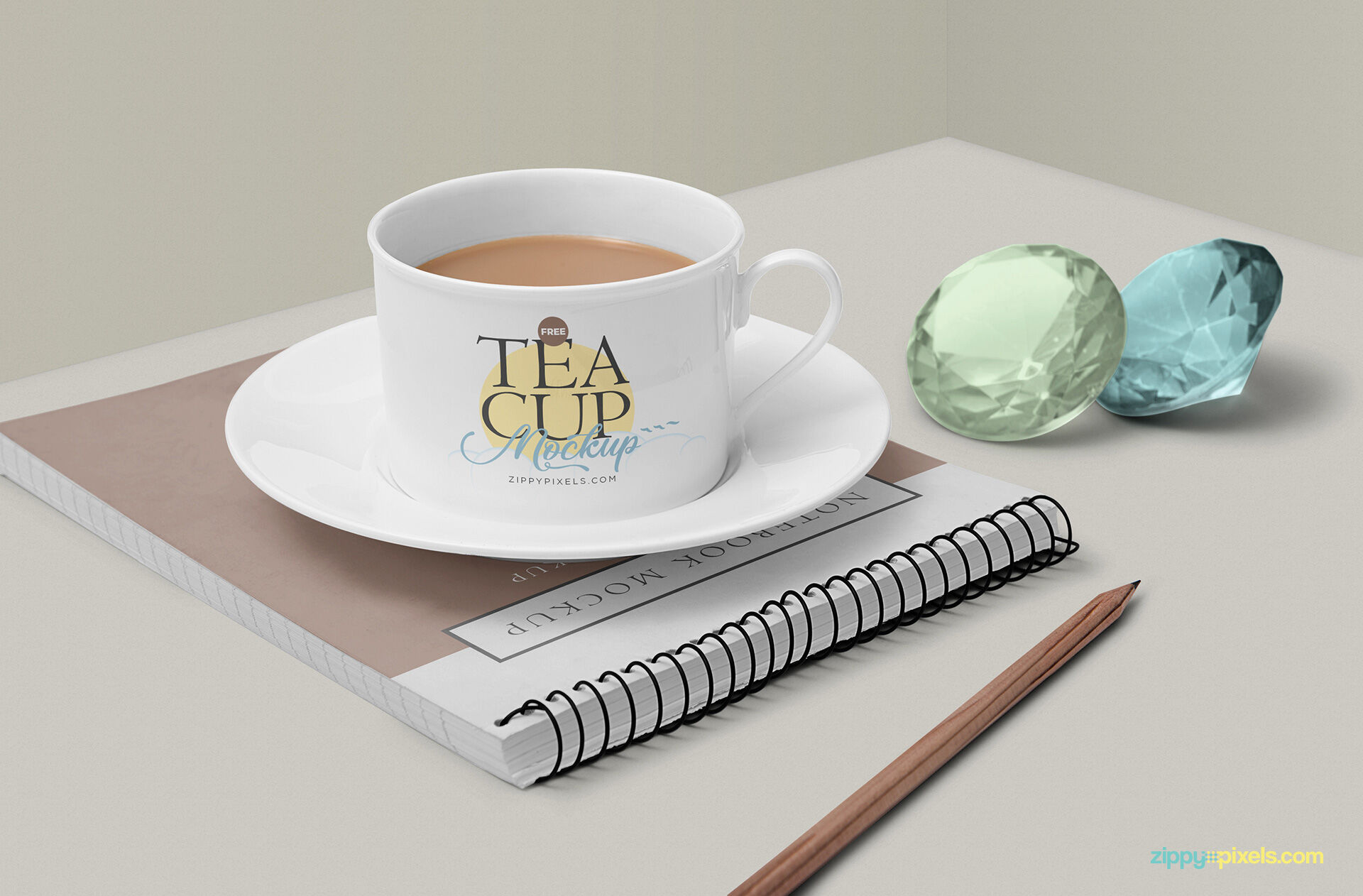 Tea Cup Mockup Featuring Ringed Notebook, Gemstones and a Pencil FREE PSD