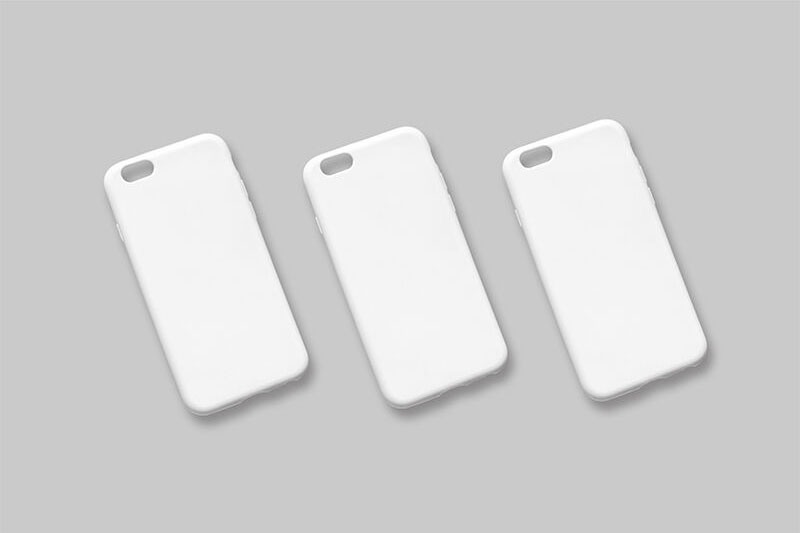 Three iPhone Cases Put Diagonally on the Surface Mockup FREE PSD