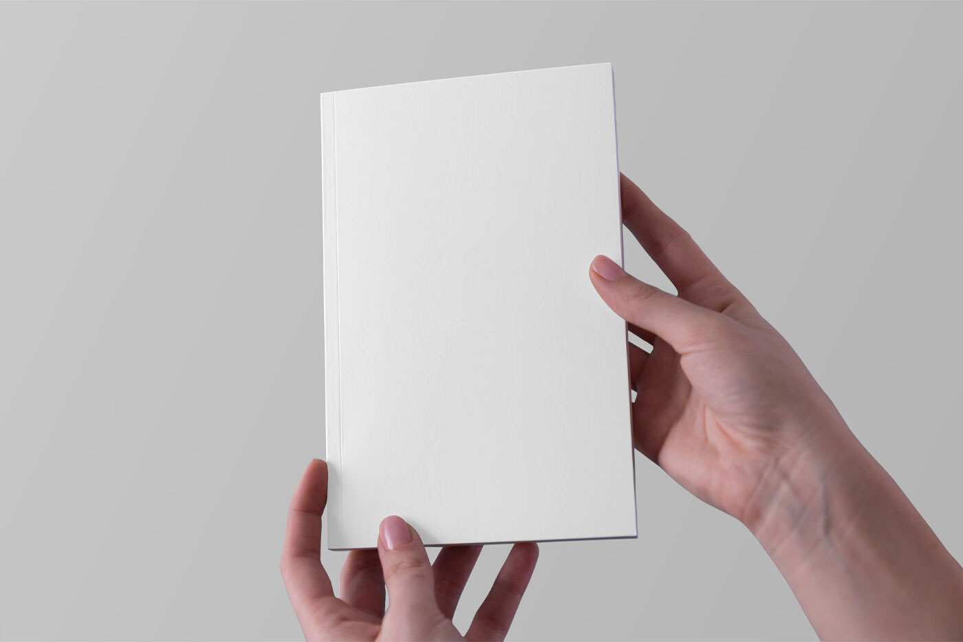 Two Hands Holding a Notebook Mockup FREE PSD