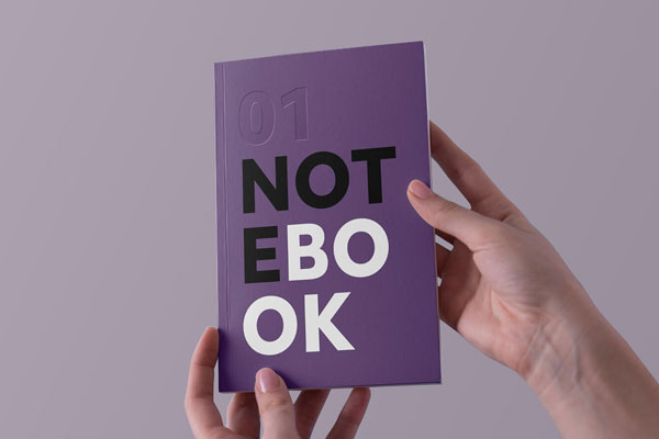 Two Hands Holding a Notebook Mockup FREE PSD