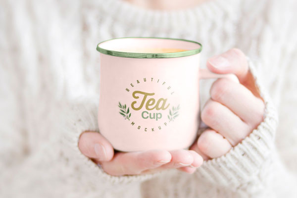 Woman Holding Tea Cup in Hand Mockup FREE PSD