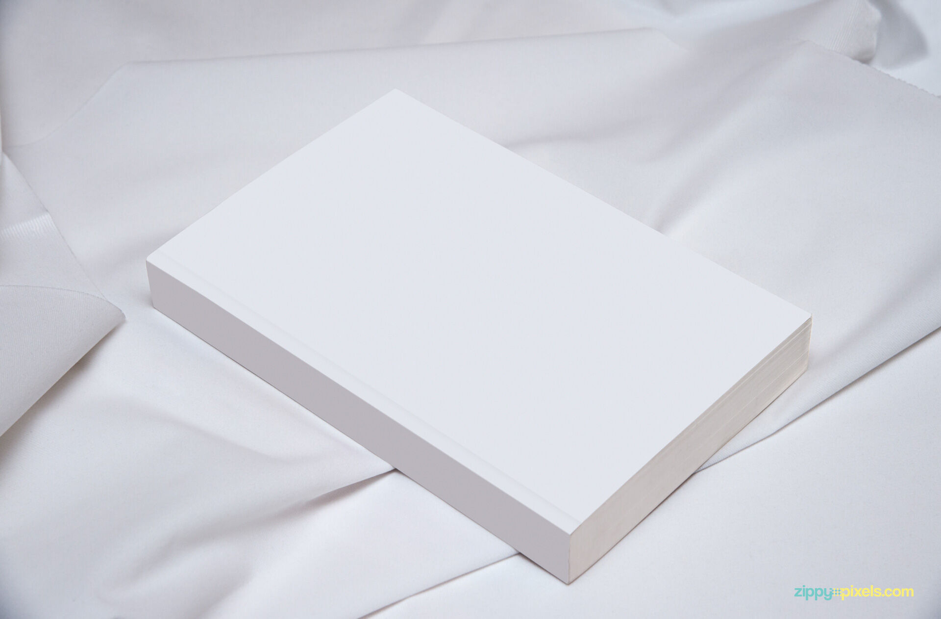 Book Mockup Template Laid on Cotton Sheet in Perspective FREE PSD