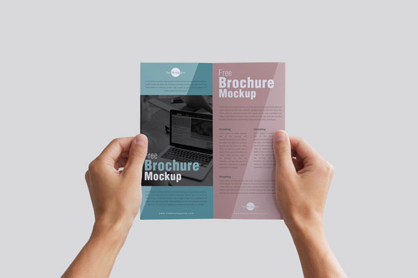 Brochure Holding by Hands in a Front View Mockup FREE PSD