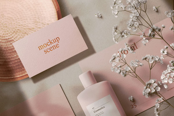 Different Sizes Cards and Cosmetic Bottle in Floral Setting Mockup FREE PSD