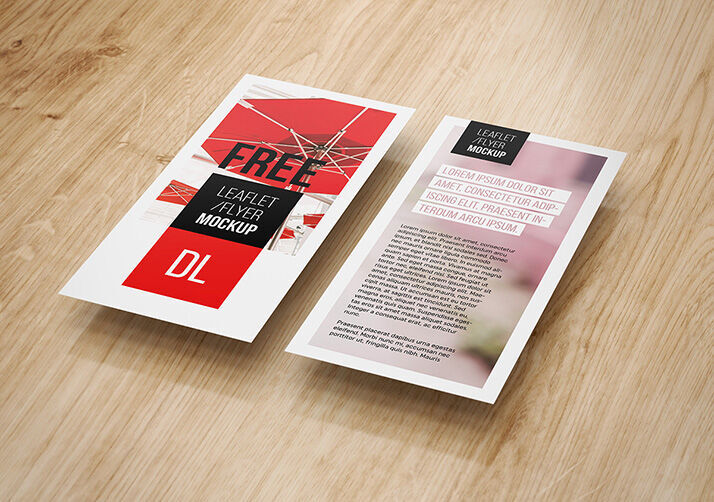Four Mockups Featuring DL Flyers on Wooden Texture FREE PSD