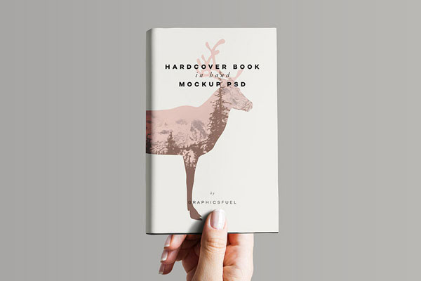 Hand Holding Hardcover Book Mockup FREE PSD