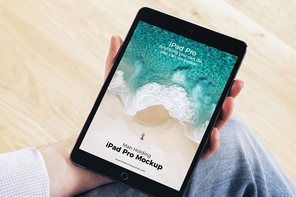Mockup Featuring iPad Pro Grabbed by Hand with a 3\4 Angle View FREE PSD