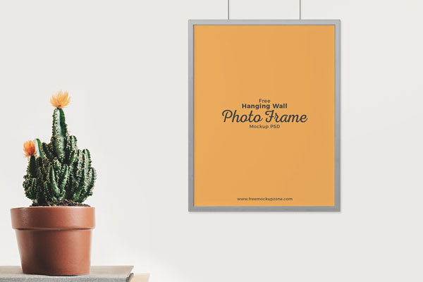 Mockup Featuring Photo Frame Hung on Wall in a Front View FREE PSD