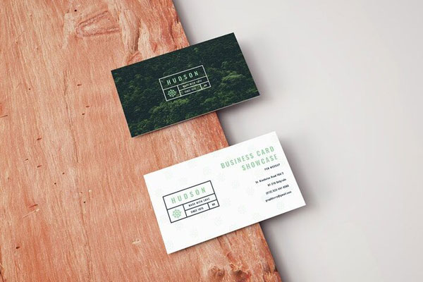 Mockup Featuring Two Business Cards Laid on Wooden Board in Perspective FREE PSD