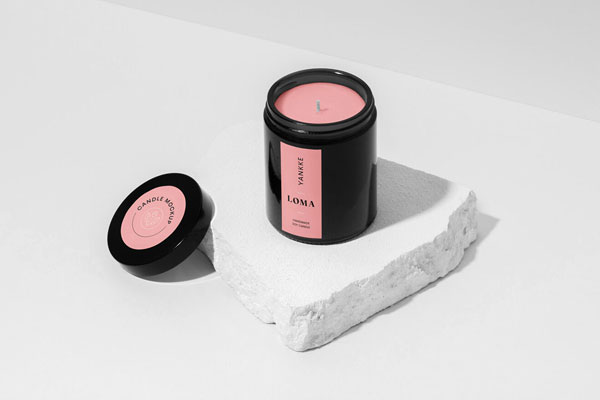 Mockup of a Candle Placed on a Piece of Stone FREE PSD