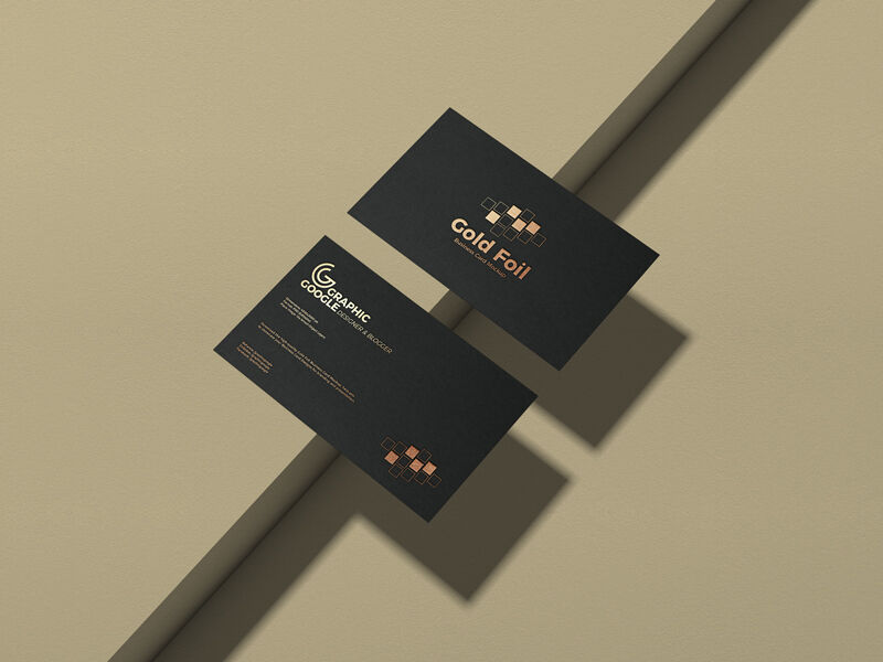 Mockup of Two Golden Foil Business Cards at the 3\4 Angle View FREE PSD