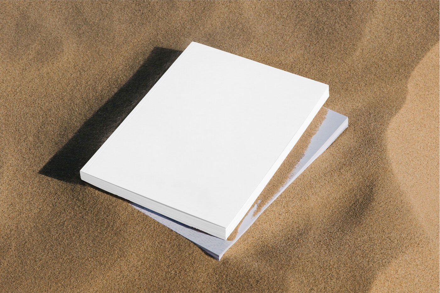 Mockup of Two Thick Magazines in Sand FREE PSD