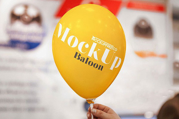 Mockup Showcasing Hand Holding Balloon with Blurry Background FREE PSD