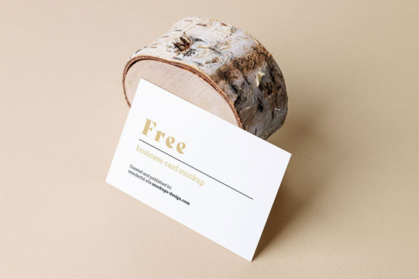 Mockup Showcasing Side View of Business Card against Wood Trunk FREE PSD