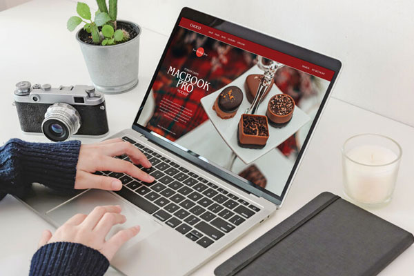 Person Using MacBook Pro Workspace Mockup FREE PSD