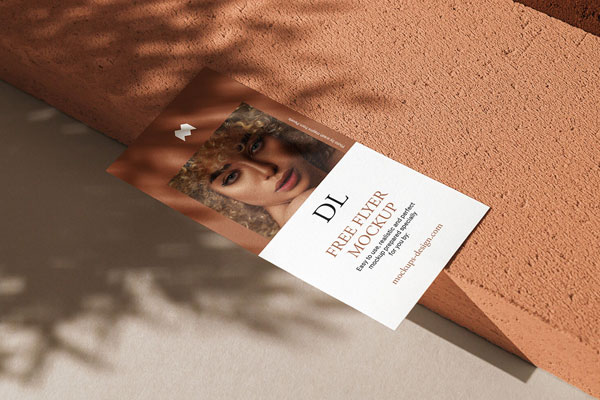 Realistic Dl Flyer Lying on a Concrete Stone Mockup FREE PSD