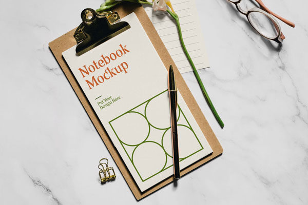 Realistic Notebook Mockup with Flower and glasses FREE PSD