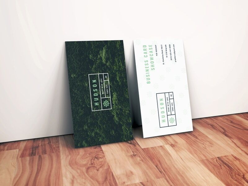 Side View of Two Standing Business Cards against Wall Mockup FREE PSD